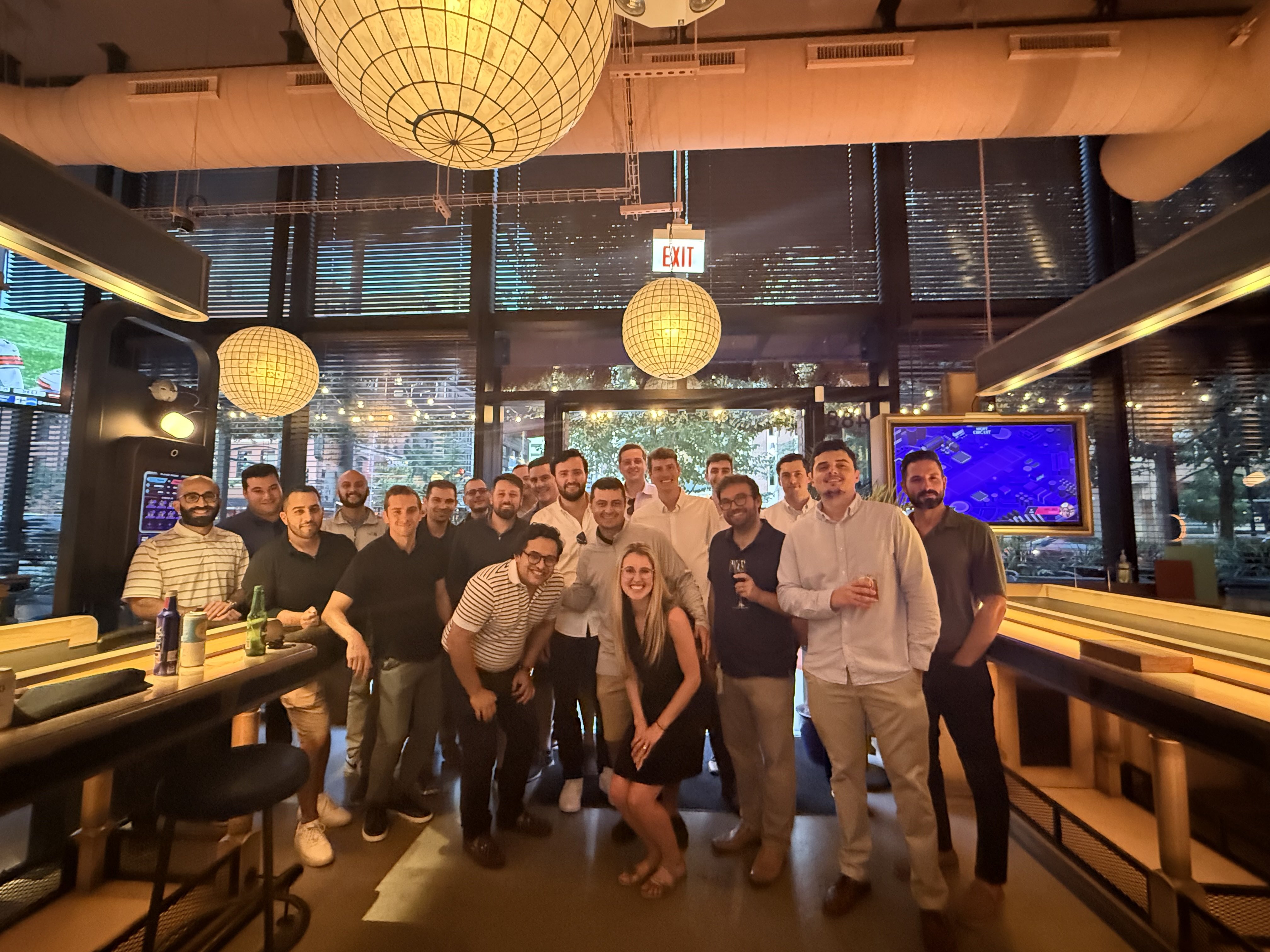 Full Waylin Partners team group photo at a bar during the Tampa offsite